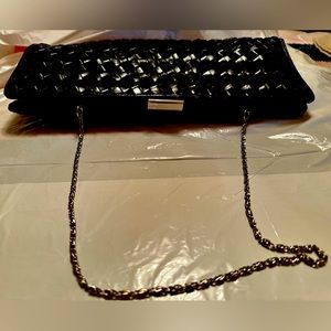 Black woven rectangular shape leather handbag w/chain by Bloomingdales